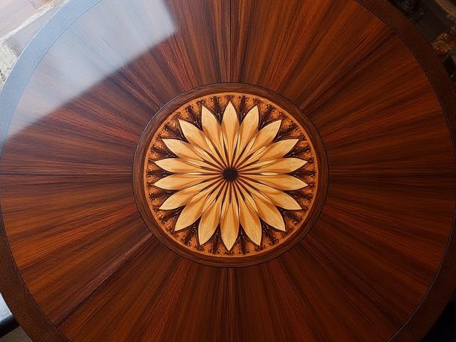 Custom marquetry tabletop featuring a central medallion of maple, walnut, and padauk.